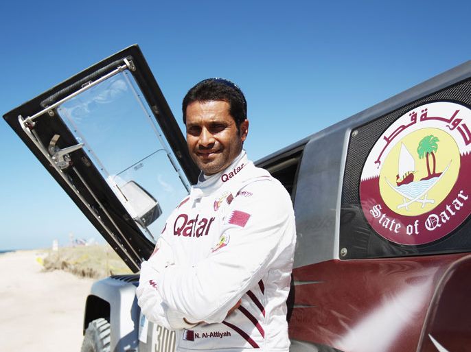 ANTA ROSA DE LA PAMPA, ARGENTINA - JANUARY 01: Nasser Al-Attiyah of Qatar poses for a photo in front of his Hummer prior to stage one of the 2012 Dakar Rally from Mar Del Plata to Santa Rosa de la Pampa on January 1, 2012 in Santa Rosa de la Pampa, Argentina. (Photo by Bryn Lennon/Getty Images)