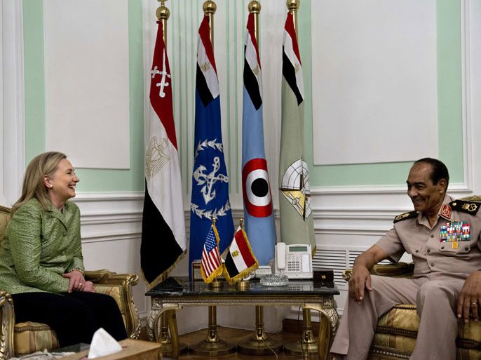 US Secretary of State Hillary Clinton meets with Egypt's head of the military council Field Marshal Hussein Tantawi at the Ministry of Defense on July 15, 2012 in Cairo. Clinton was holding talks with Egypt's top military leaders, just hours after calling for them to help smooth the country's full transition to democracy. AFP PHOTO/POOL/Brendan SMIALOWSKI