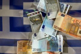 epa03079906 An illustration photograph dated 26 January 2012 shows euro bills lying on a Greek flag in Cologne, Germany. Reports omn 26 January 2012 state that Athens is intensively looking for ways to prevent the financial demise of Greece. Bankers and financial experts ar emeeting with the Greek government in order to realise a debt cut. EPA/OLIVER BERG