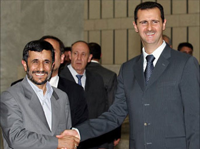 f_Syrian President Bashar al-Assad (R) shakes hands with his Iranian counterpart Mahmoud Ahmadinejad prior their offical meeting at the Syrian al-Shaab Presidential Palace in Damascus, 19 July 2007. Ahmadinejad flew in Damascus for talks with Assad and Khaled Mishaal, exiled supremo of the Islamist Palestinian movement Hamas. AFP PHOTO/LOUAI BESHARA