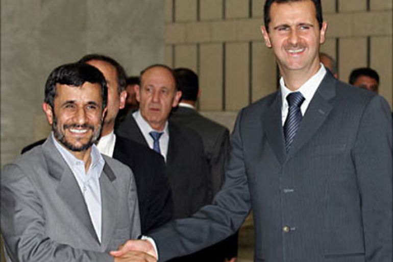 f_Syrian President Bashar al-Assad (R) shakes hands with his Iranian counterpart Mahmoud Ahmadinejad prior their offical meeting at the Syrian al-Shaab Presidential Palace in Damascus, 19 July 2007. Ahmadinejad flew in Damascus for talks with Assad and Khaled Mishaal, exiled supremo of the Islamist Palestinian movement Hamas. AFP PHOTO/LOUAI BESHARA