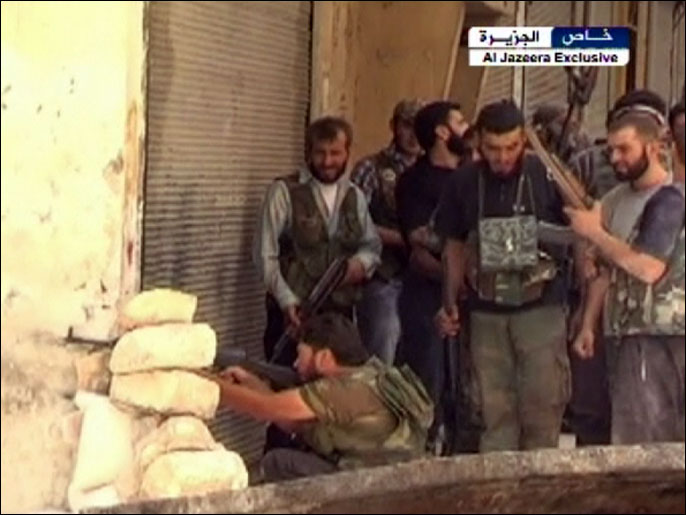 ‪مقاتلو الجيش الحر في أحد أحياء حلب‬ مقاتلو الجيش الحر في أحد أحياء حلب