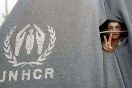 A Syrian refugee who fled the violence in his county flashes the victory sign at Bashabsheh refugee camp, at Jordan-Syria Border, Ramtha City, 90Km North of Amman, Jordan, 17 July 2012.