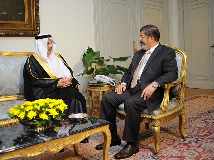A handout picture released by the Egyptian presidency shows Egyptian President Mohamed Morsi (R) meeting with the Saudi ambassador in Egypt, Ahmed Qattan, at the presidential palace in Cairo on July 7, 2012. AFP PHOTO/EGYPTIAN PRESIDENCY/MOHAMED SAMAAHA