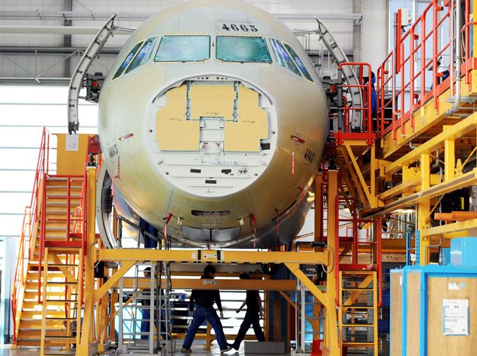 epa02597485 General view of Airbus staff working on an A320 passenger plane at