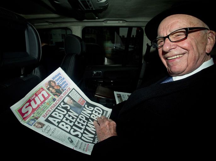 Chairman, Rupert Murdoch reads a copy of The Sun newspaper as he leaves his house in London, Britain, 17 February 2012. The 80-year-old tycoon is to address staff at the tabloid Sun newspaper, following the arrest of five senior journalists in connection with corruption allegations. In an initial response to the arrests, Murdoch dismissed fresh speculation over the future of the Sun, a tabloid with a daily circulation of 2.7 million