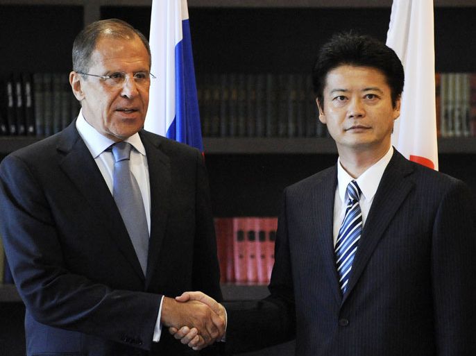 Russian Foreign Minister Sergei Lavrov (L) shakes hands with his Japanese counterpart Koichiro Gemba before their meeting in Sochi on July 28, 2012. AFP PHOTO / MIKHAIL MORDASOV