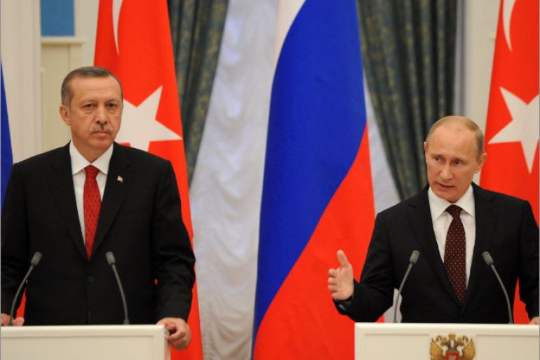 Russian President Vladimir Putin (R) and Turkish Prime Minister Recep Tayyip Erdogan speak during a press conference after their meeting to discuss differences on Syria as UN Security Council prepared to vote on the conflict, in Moscow's Kremlin on July 18, 2012. Russia said today a decisive battle was in progress in Syria and rejected a Western-backed UN resolution on the crisis as it would mean taking sides with a revolutionary movement. AFP PHOTO/KIRILL KUDRYAVTSEV