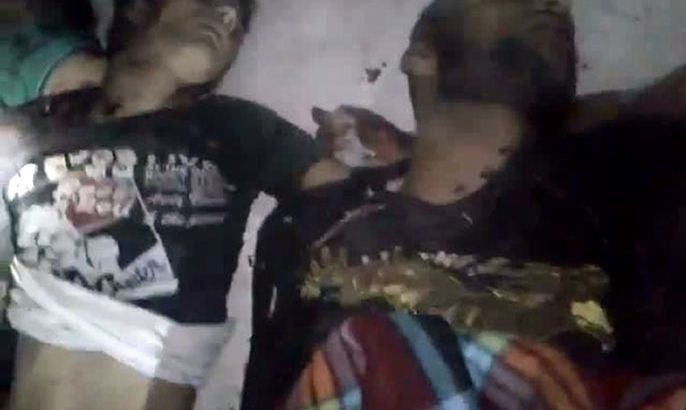 An image grab taken from a video uploaded on YouTube on July 13, 2012, allegedly shows bodies of men who were killed in a reported massacre in the village of Treimsa, in the central province of Hama