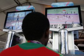Lestrod Roland, a runner from Saint Kitts and Nevis, plays a video game at the Athletes' Village at the Olympic Park, on July 22, 2012 in London. The opening ceremonies of the Olympic Games are scheduled for Friday, July 27. AFP PHOTO / POOL - Jae C. Hong