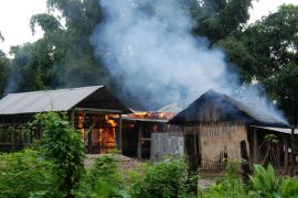 A house burns at Kachugaon village in Kokrajhar district, about 230 kms from Guwahati, the capital city of the northeastern state of Assam during violent clashes on July 23, 2012. Police issued shoot-on-sight orders on July 23 in a bid to quell violent clashes between Bodo tribal groups and Muslim settlers over land rights in India's remote northeast that have prompted thousands of villagers to flee their homes and left 19 people dead. AFP