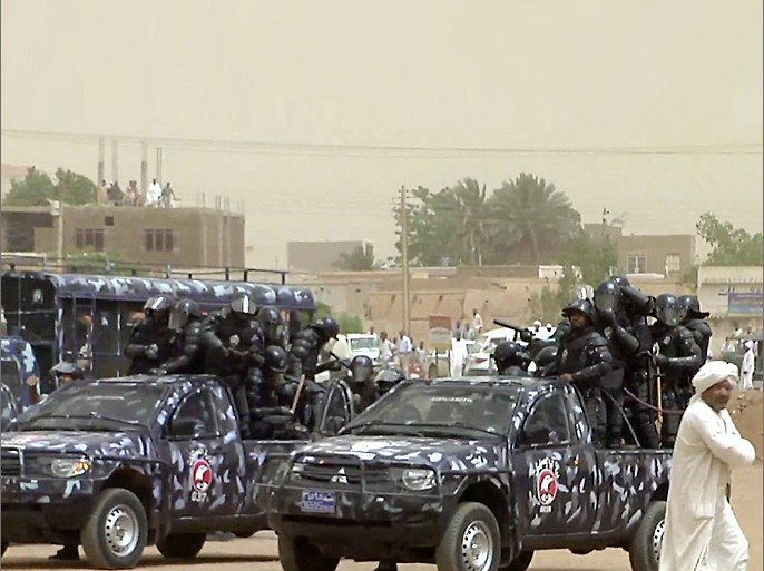An image grab taken from AFP TV shows Sudanese riot policemen taking position outside the Wad Nabawi mosque in Khartoum's twin city of Omdurman on July 6, 2012. Sudanese police "attacked" with tear gas and rubber bullets as demonstrators gathered at mosques for weekly anti-regime protests sparked by inflation, a rights group said. AFP PHOTO/STR
