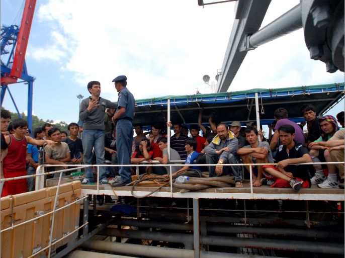 epa03176687 Afghan asylum seekers wait for Indonesian immigration officer on a Singaporean tanker at a port in Merak, Banten, Indonesia, 09 April 2012. The tanker rescued around 120 asylum seekers that were aboard a wooden boat which had started to sink in waters between Sumatra and Java. The tanker brought them to immigration officials at the port of Merak. EPA/TUBAGUS