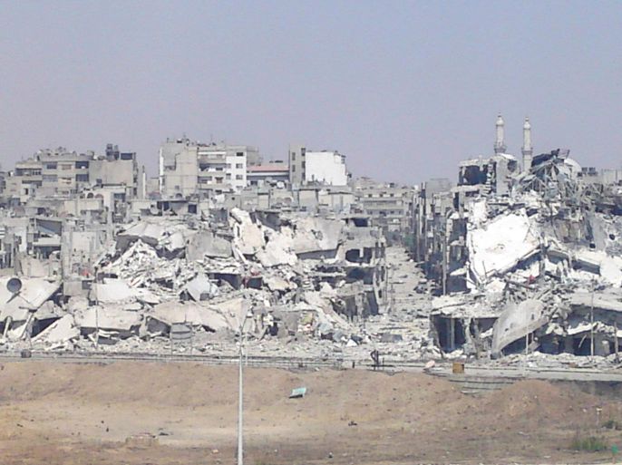 Damaged buildings are seen in Juret al-Shayah in Homs July 16, 2012. REUTERS