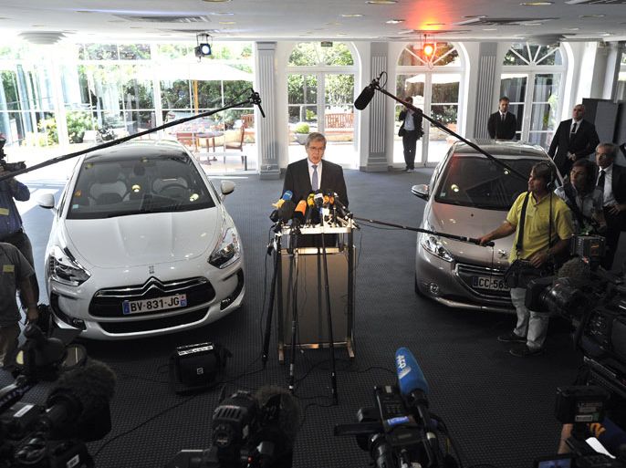 epa03317027 Chief Executive of French carmaker PSA Peugeot Citroen, Philippe Varin, speaks to journalists after holding a press conference to present the company's first-half results for 2012, in Paris, France, 25 July 2012. French carmaker Peugeot Citroen posted a 662 million euro ($800 million) first-half loss in its auto division and had announced earlier in July plans to cut 8,000 jobs and would stop production at the Aulnay plant near Paris, which employs some 3,000 workers. EPA/YOAN VALAT