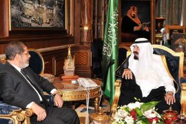 A handout photograph made available by the Egyptian Presidency on 12 July 2012, shows Egypt's President Mohamed Morsi (L) and Saudi Arabia's King Abdullah bin Abdul Aziz (R) during their meeting in Jeddah, Saudi Arabia, late 11 July 2012.