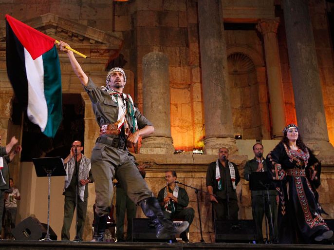 Palestinian band Al-Ashiqeen or Lovers, sing Palestinian national songs, during their show at the Jerash festival in Jerash, north of Amman, Jordan, on 27 July 2011. After a three year absence the festival is back and runs from 21 until 30 July 2011. The Jerash Festival for culture and arts kicks off with performances by renowned singers and dance and folklore troupes from across the Arab region and the world. EPA/JAMAL NASRALLAH
