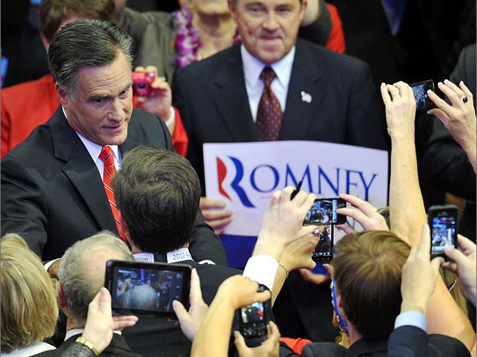 Republican presidential candidate Mitt Romney talks to supporters as he arrives for his acceptance speech at the Tampa Bay Times Forum in Tampa, Florida, on August 30, 2012 on the final day of the Republican National Convention (RNC). The RNC culminates today with the formal nomination of Mitt Romney and Paul Ryan as the GOP presidential and vice presidential candidates in the US presidential election. AFP PHOTO / Mladen ANTONOV