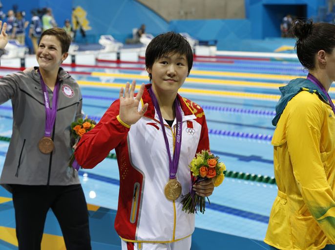 Alicia Coutts of Australia (silver), Ye Shiwen of China (gold) and Caitlin Leverenz of the US (bronze) celebrate after the women's 200m Individual Medley en route to a gold medal during the London 2012 Olympic Games Swimming competition, London, Britain, 31 July 2012. EPA/BARBARA WALTON