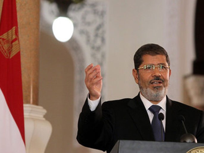 Egyptian President Mohamed Morsi speaks during a press conference with Tunisian President Moncef Marzouki (not pictured) at the presidential palace, in Cairo, Egypt, 13 July 2012. Marzouki is the first head of state to meet with Morsi in Cairo since he was sworn-in on 30 June 2012. Morsi on 12 July returned from a visit to Saudi Arabia during which he met with king Abdullah bin Abdul Aziz. EPA/KHALED ELFIQI