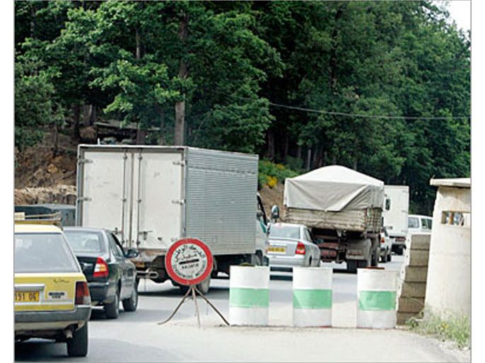 cars queue at an army checkpoint in algeria's kabylie region, 200 km (124 miles) east of algiers, in this picture taken may 24, 2008. the mountains of northern algeria have long sheltered outlaws, but it's not just rugged terrain that draws al qaeda to ravines and forests. the local berbe