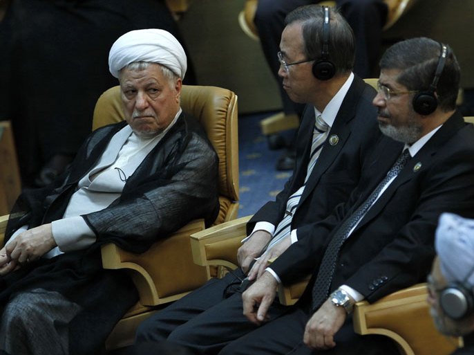 Egyptian President Mohamed Morsi (R), UN Secretary General Ban Ki-Moon (C) and Iran's former president Akbar Hashemi attend the Non-Alligned Movement (NAM) summit in Tehran on August 30, 2012. AFP PHOTO/MEHR NEWS/RAOUF MOHSENI