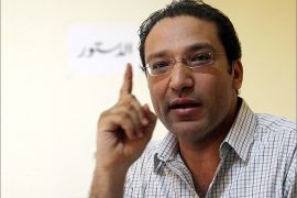 (FILES) A picture dated on August 13, 2012 shows Islam Afifi, editor of Egyptian El-Dostour newspaper, gesturing during a meeting at the newspaper's offices in Cairo on August 13, 2012. An Egyptian court remanded editor Islam Afifi in custody on August 23, 2012 as he went on trial on charges of spreading false news and inciting disorder in a case that has sparked US concern. The judge at the Giza Criminal Court in greater Cairo ordered Afifi held until the next hearing, which he set for September 16. AFP PHOTO/STR