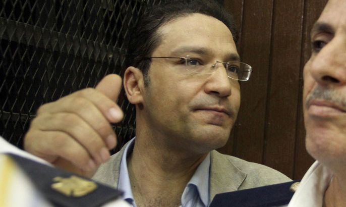 Egyptian journalist Islam Afifi is pictured in court during his trial in Cairo on August 23, 2012. An Egyptian court remanded the editor of the small independent Al-Dustour newspaper in custody as he went on trial on charges of spreading false news and inciting disorder in a case that has sparked US concern. AFP PHOTO / AHMED MAHMUD