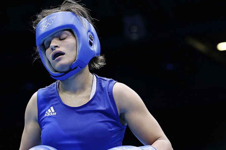 Rim Jouini of Tunisia reacts after being issued a warning against Alexis Pritchard of New Zealand during the women's Lightweight (60kg) boxing round of 16 of the 2012 London Olympic Games at the ExCel Arena August 5, 2012 in London. AFP PHOTO / Jack GUEZ