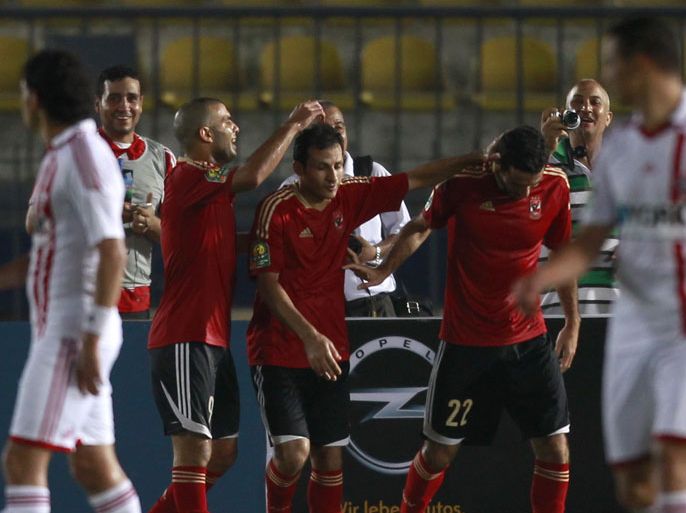 Mohamed Aboutrika of Egypt's Al Ahly (2nd R) celebrates with teammates after scoring his goal against Egypt's Zamalek during their CAF Champions League soccer match at the Military Stadium in Cairo July 22, 2012