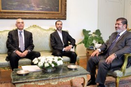 Egyptian President Mohamed Morsi (R) meets with Iranian Vice President Hamid Baghaei (C) in the presence of Egyptian Foreign Minister Mohammed Kamel Amr (L) at the presidential palace, in Cairo, Egypt, 08 August 2012. Baghaei arrived in Cairo on 07 August for talks with Egyptian President Mohammed Morsi. He is expected to officially invite Morsi to attend a Non-aligned Movement summit due to be held later this month in Tehran. Baghaei's visit is the first by a senior Iranian official to Egypt since a popular revolt deposed Hosni Mubarak from power last year. EPA/KHALED ELFIQI