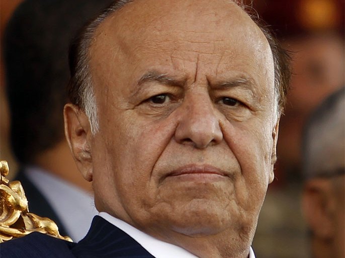 Yemen's President Abd-Rabbu Mansour Hadi attends a parade marking the 22nd anniversary of Yemen's reunification in Sanaa May 22, 2012. Yemeni soldiers marched in the National Day parade on Tuesday, one day after a bomber killed more than 90 of their comrades in an attack on the ceremony's rehearsal.