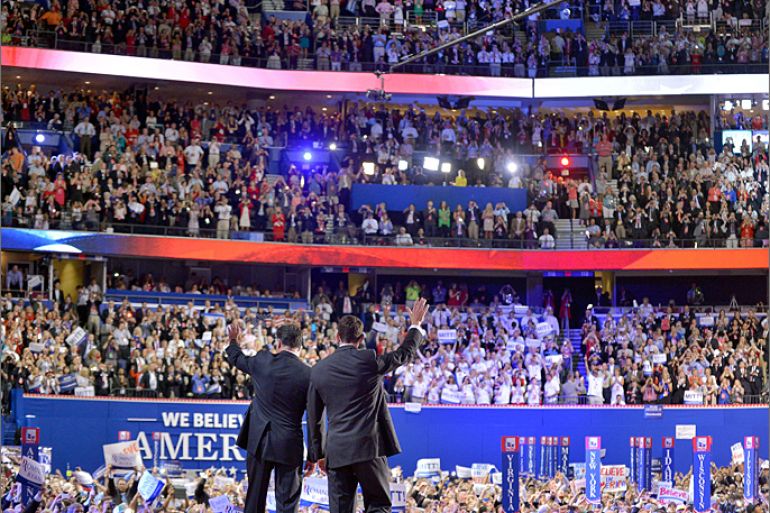 Republican presidential candidate Mitt Romney and running mate Paul Ryan wave following Romney's address at the Republican National Convention (RNC) at the Tampa Bay Times Forum in Tampa, Florida, on August 30, 2012. White House challenger Romney vowed to rescue the US economy and create jobs as he accepted the Republican presidential nomination at the climax of a convention that sought to humanize the candidate. AFP PHOTO/Jewel Samad
