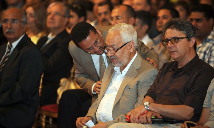 Tunis, -, TUNISIA : Tunisia's islamist Ennahdha party founder and president Rached Ghannouchi (C) attends the opening of the second national Congress of the CPR (Congress for the Republic) party on August 24, 2012 in Tunis. The party of Tunisian President Moncef Marzouki, opened its congress in Tunis today to determine its strategy for the 2013 elections, amid internal divisions and disagreements with its Islamist allies. AFP PHOTO / FETHI BELAID