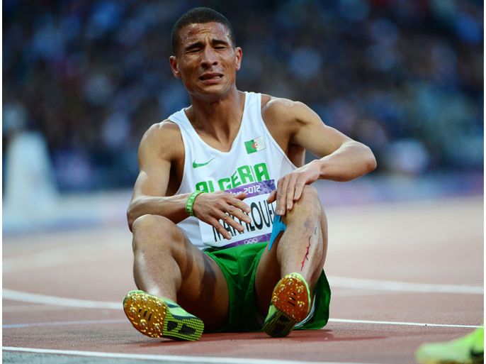 Algeria's Taoufik Makhloufi reacts after competing in the men's 1500m semi-finals at the athletics event during the London 2012 Olympic Games on August 5, 2012 in London. AFP PHOTO / OLIVIER MORIN