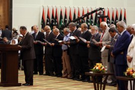 Members of the National Congress of the year during the performance of the constitutional right during the transfer of authority ceremony in tripoli on August 8, 2012. Libya's National Transitional Council on Wednesday handed power to
