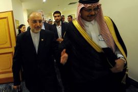 Iranian Foreign Minister Ali Akbar Salehi (L) is escorted by an unidentified Saudi protocol official upon his arrival to attend a preparation meeting of foreign ministers of the Organisation of Islamic Cooperation (OIC) in the Saudi coastal city of Jeddah on August 13, 2012
