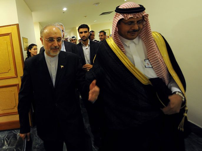 Iranian Foreign Minister Ali Akbar Salehi (L) is escorted by an unidentified Saudi protocol official upon his arrival to attend a preparation meeting of foreign ministers of the Organisation of Islamic Cooperation (OIC) in the Saudi coastal city of Jeddah on August 13, 2012