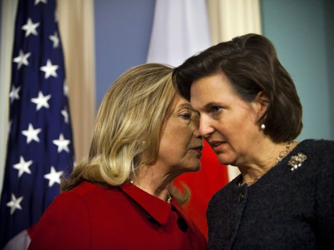 U.S. Secretary of State Hillary Clinton (L) chats with State Department spokesperson Victoria Nuland (R) before delivering remarks about the death of North Korean dictator Kim Jong Il after a bilateral meeting with Japanese Foreign Minister Koichiro Gemba at the State Department in Washington, DC USA 19 December 2011. Reports state that the communist country's Leader is believed to have died of a heart failure while on a train trip in North Korea. EPA/JIM LO SCALZO