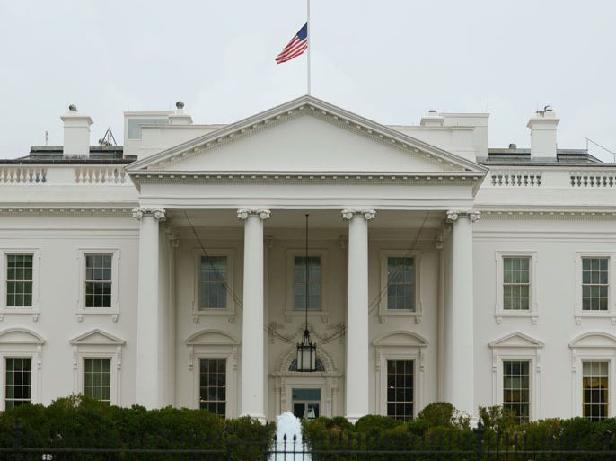 The US national flag is flown at half staff at the White House, in observance of the tragic Colorado shooting, in Washington DC, USA, 20 July 2012. President Obama cut short a two-day campaign trip to Florida after a shooting at a movie theater that killed twelve and injured dozens in Aurora, Colorado. EPA/MICHAEL REYNOLDS