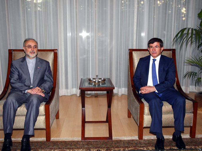 Ankara, Ankara, TURKEY : Iranian Foreign Minister Ali Akbar Salehi (L) and his Turkish counterpart Ahmet Davutoglu are pictured before a meeting in Ankara, on August 7, 2012. Turkey can play a "major role" in freeing 48 Iranian pilgrims abducted in Syria because of its links with the Syrian opposition, Iran's foreign minister said on Tuesday. AFP PHOTO/ADEM ALTAN