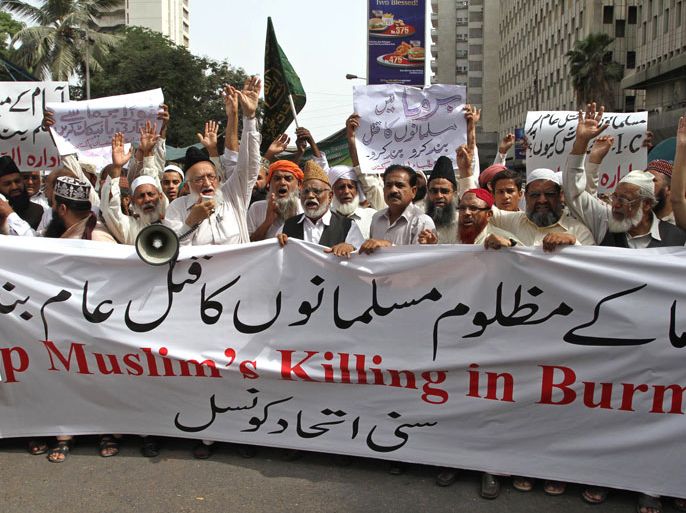 epa03344716 Supporters of Sunni Ittehad council Pakistan hold banners and shout slogans during a protest against Myanmar, in Karachi, Pakistan, 06 August 2012. Pakistani militants, on 26 July, had threatened to attack Myanmar over the alleged killings of fellow Muslims of the Rohingya ethnic community. Tehrik-e-Taliban Pakistan (TTP), an umbrella organization of more than a dozen militant groups based in lawless tribal areas along the Afghan border, also demanded Pakistan to severe diplomatic ties with Myanmar, which is also known as Burma, and expel its ambassador. In July 2012 at least 50 people died and hundreds of homes were burned in Myanmar's sectarian violence, sparked by the alleged rape and murder of a Buddhist woman by three Rohingya Muslims. EPA/REHAN KHAN