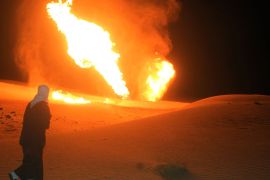 A file picture dated 10 November 2011 shows flames rising from a gas pipeline following a blast in Al-Arish northern Sinai, Egypt. According to media reports an explosion occurred on 22 July 2012, at al-Tuwail, East of the Sinai town of al-Arish, at a place before the pipeline diverges into Israel and Jordan directions, in the 15th such attack on the line that transports gas to Israel and Jordan since the end of former president Hosni Mubarak ruling. Although company's officials state that the pipeline has not been working since last April's explosion, other sources indicate that shipments to both Israel and Jordan had been resumed on 19 July.