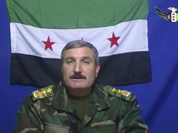 In this undated file photo, Syrian Commander Riad al-Asaad, who heads a group of Syrian army defectors appears on a video posted on the group'sFacebook page. Syrians hoping for a swift rebel victory in their homeland are growing impatient with top army defectors who are staying behind inTurkey, even though their comrades are gaining territory in northern Syria. But now