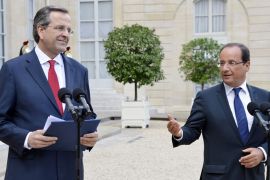 epa03369459 Greek Prime Minister Antonis Samaras (L) and French President Francois Hollande (R) speak to media after their meeting at the Elysee Palace in Paris, France, 25 August 2012. Greek Prime Minister Antonis Samaras met French President Francois Hollande for talks on the tough reforms Athens is required to implement to secure further international bailout loans. Samaras is on a diplomatic offensive to shift the near-bankrupt country's deficit-cutting target from 2014 to 2016. Greece is required to cut 11.5 billion euros (14.4 billion dollars) in public spending over the next two years in order to qualify for a second instalment of bailout funds from the European Union and International Monetary Fund. EPA/STEPHANE REIX