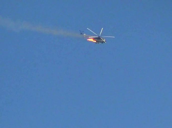 Damascus, -, SYRIA : An image grab taken from a video uploaded on YouTube on August 27, 2012 shows a burning Syrian combat helicopter crashing as fierce fighting reportedly gripped east of the capital Damascus. State television said the chopper came down near a mosque in Qabun, but gave no further information, while the Syrian Observatory for Human Rights said it believed it "was hit while it was being used in fighting nearby." AFP PHOTO/YOUTUBE