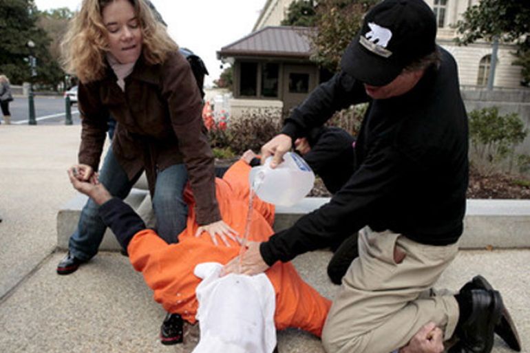 Human rights activists demonstrate waterboarding on a volunteer outside the Dirksen Senate office building on Capitol Hill in Washington DC USA on 06 November 2007. The Senate Judiciary Committee will vote today on the nomination of Michael Mukasey, President Geroge W. Bush's nominee for Attorney General. Mukasey refuses to say whether waterbaording, which simulates drowning, is or is not torture. EPA/MATTHEW CAVANAUGH