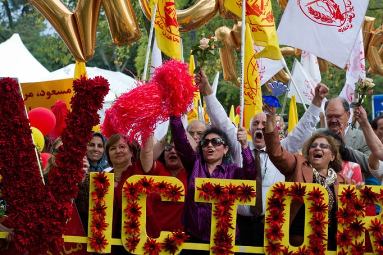 • Supporters of the Iranian opposition group based abroad, the People's Mujahedeen of Iran (Mujahedeen-e-Khalq) shout slogans as celebrate the removal of the group from the US black list of designated terror groups in Washington, DC on September 28, 2012. The move, ending a complex legal battle fought through US and European courts, came just days ahead of a US appeals court October 1 deadline forcing Secretary of State Hillary Clinton to decide the group's fate.