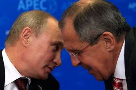 Russia's President Vladimir Putin (L) and Foreign Minister Sergei Lavrov chat before their meeting with Japan's Prime Minister Yoshihiko Noda at the Asia-Pacific Economic Cooperation (APEC) Summit in Vladivostok September 8, 2012. REUTERS