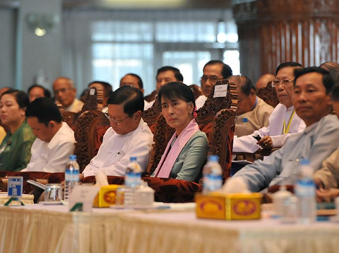 Myanmar opposition leader and head of the parliamentary committee on Rule of Law and Stability Aung San Suu Kyi (C) attends a meeting of the committee at the Yangon Division Parliament in Yangon on September 8, 2012. Suu Kyi will travel to the US on September 16, a spokesman for her party said, where she will be awarded Washington's highest honour. AFP